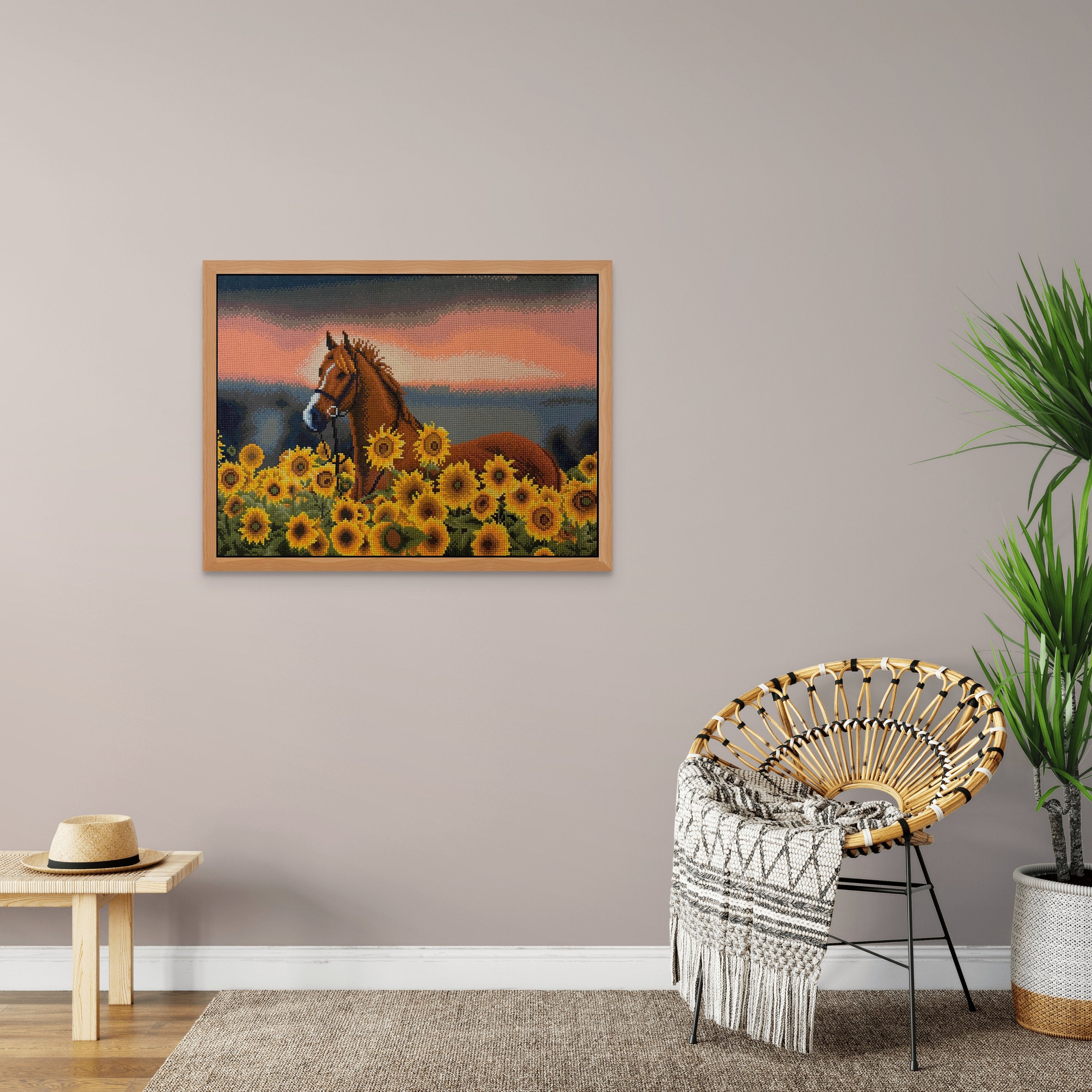 A diamond painting of Sunflower Horse hangs in a casual room with a chair and a table
