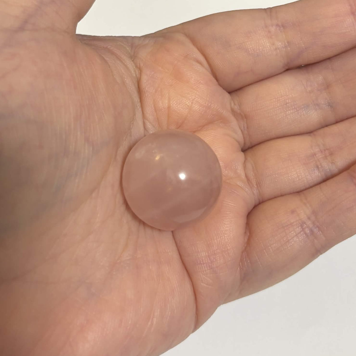 Brazilian Rose Quartz Mini Sphere with Wooden Stand – 1 in (2.5 cm) (CR-SP1)